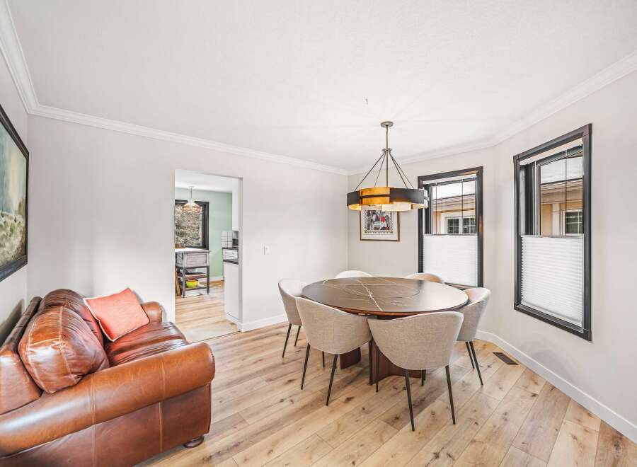 Step into this inviting dining room, featuring a stylish round table perfect for gatherings.