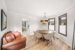 Step into this inviting dining room, featuring a stylish round table perfect for gatherings.