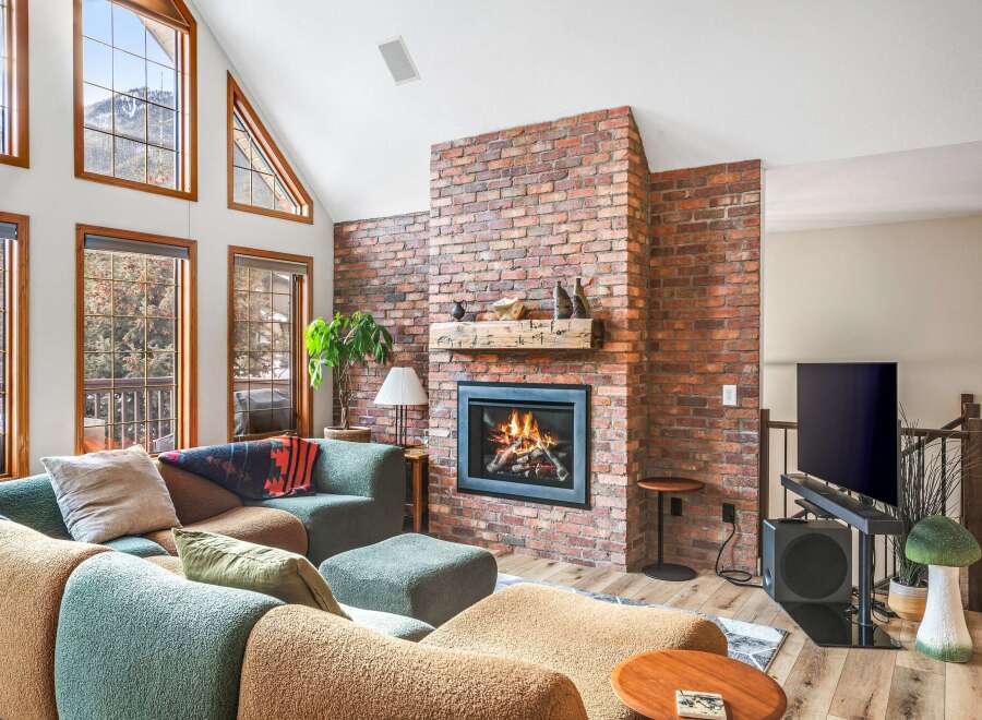 This stunning living room boasts a cozy fireplace, perfect for chilly evenings.