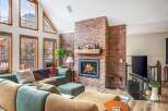 This stunning living room boasts a cozy fireplace, perfect for chilly evenings.