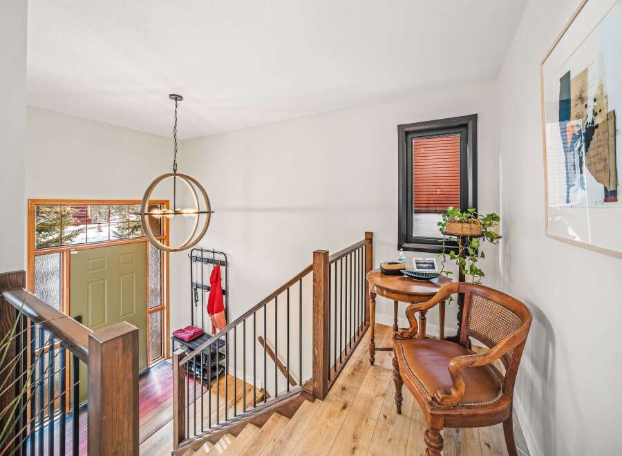 Step into this inviting entryway, showcasing a blend of modern and rustic design.