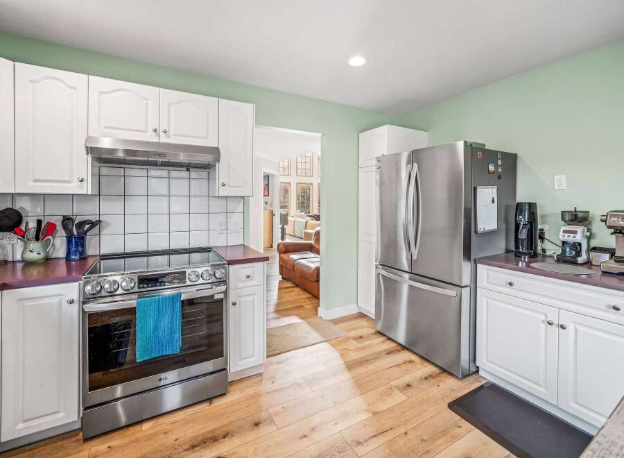 Step into this stunning kitchen, featuring sleek stainless steel appliances and ample counter space.