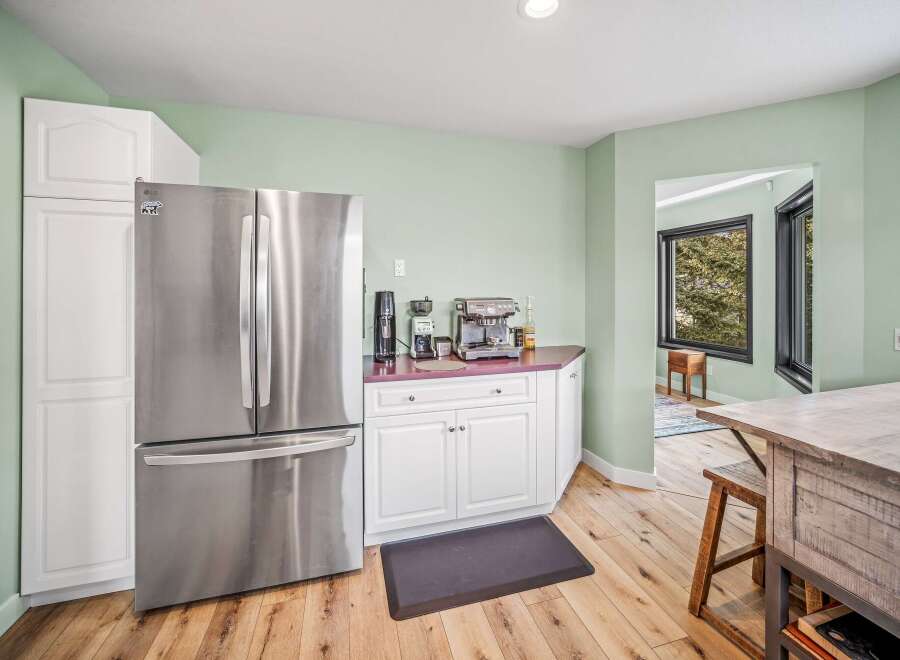 This stunning kitchen boasts a modern design with stainless steel appliances and ample storage space.