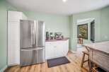 This stunning kitchen boasts a modern design with stainless steel appliances and ample storage space.