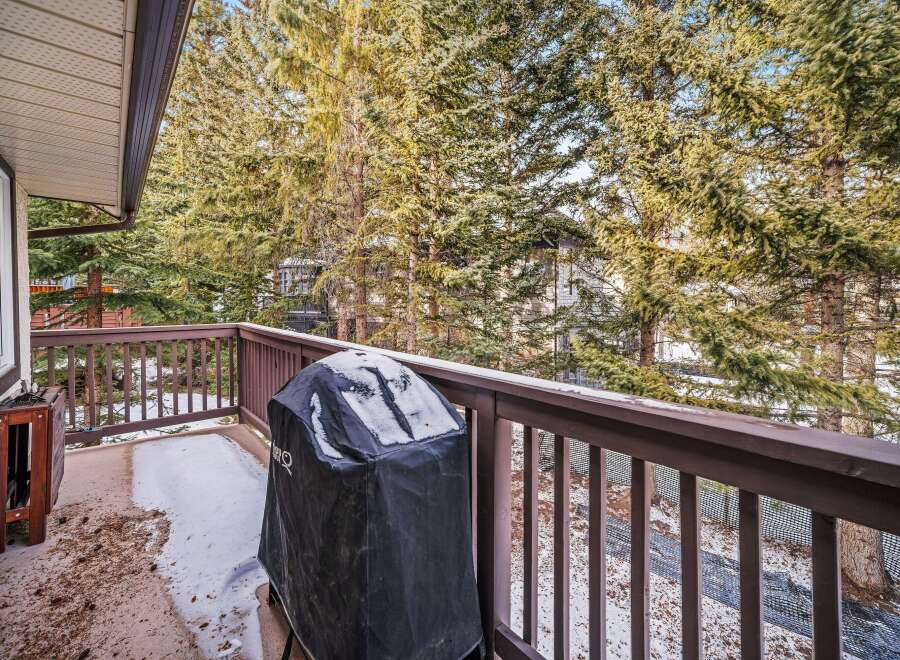 Enjoy the serene beauty of nature from this charming balcony.
