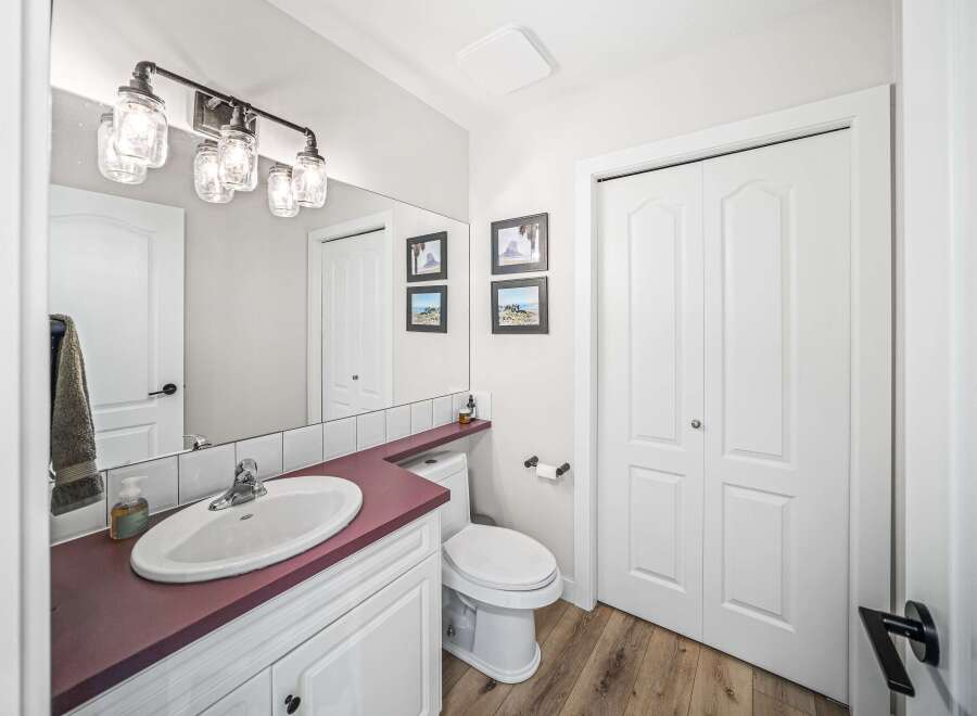 This stunning bathroom features a modern design with a touch of rustic charm.
