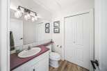 This stunning bathroom features a modern design with a touch of rustic charm.