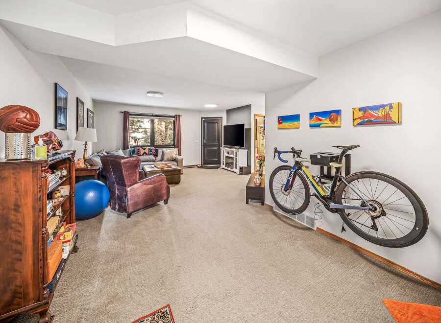 This stunning property boasts a modern interior with a spacious living area, perfect for relaxation and entertainment.