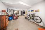 This stunning property boasts a modern interior with a spacious living area, perfect for relaxation and entertainment.