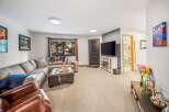 This cozy living room features a comfortable sectional sofa, perfect for relaxing and entertaining.