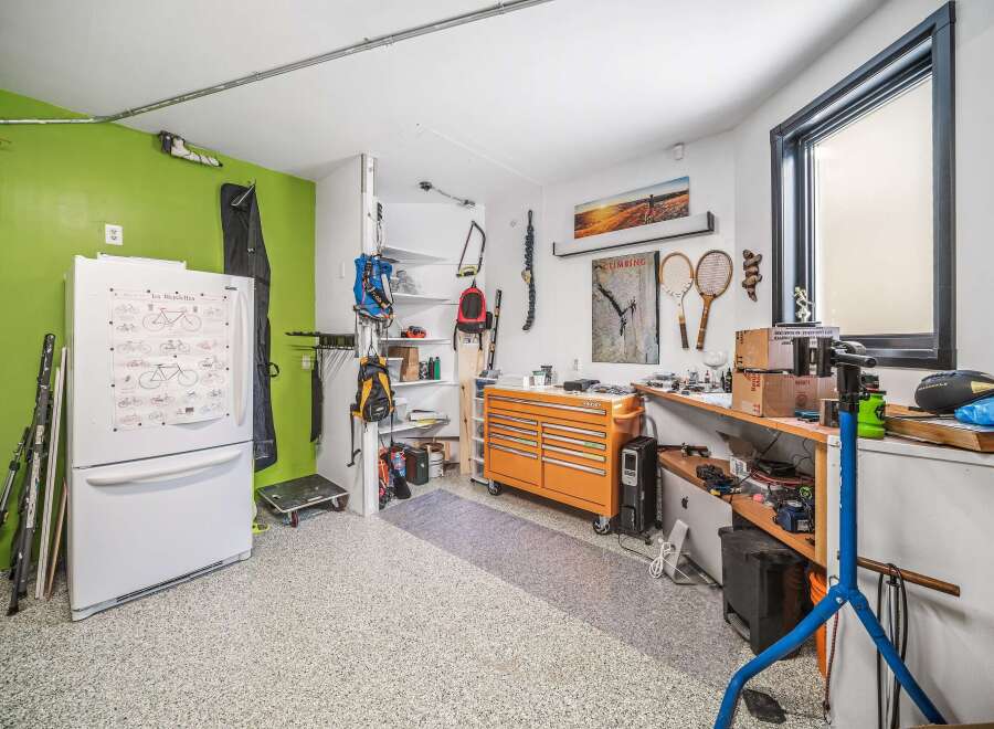 This well-organized garage offers ample space for storage and hobbies.