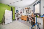 This well-organized garage offers ample space for storage and hobbies.