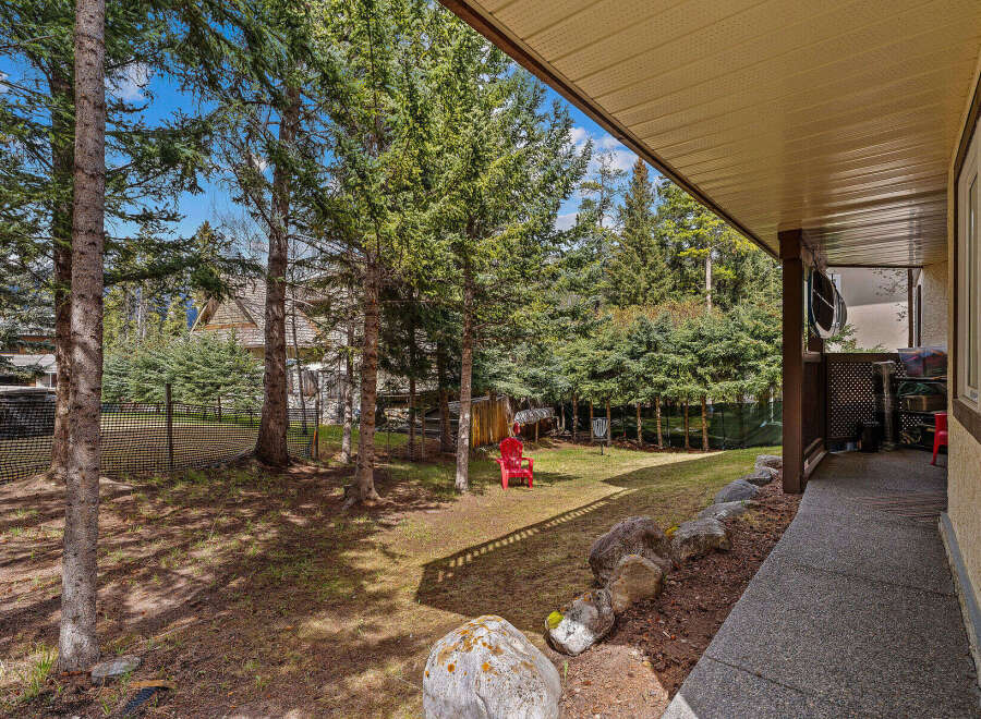Discover the tranquility of this stunning property, featuring a lush backyard oasis perfect for relaxation.