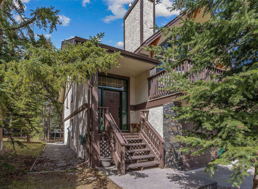 Nestled amidst lush greenery, this charming property offers a serene escape.