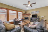 Step into a cozy living space with a rustic fireplace, perfect for those chilly evenings.