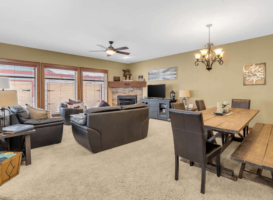 This stunning living space features a cozy fireplace, perfect for those chilly evenings.