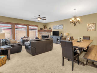 This stunning living space features a cozy fireplace, perfect for those chilly evenings.