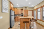 This stunning kitchen boasts beautiful wooden cabinetry, offering ample storage and a warm, inviting atmosphere.