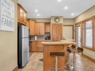 This stunning kitchen boasts beautiful wooden cabinetry, offering ample storage and a warm, inviting atmosphere.