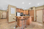 Step into this inviting kitchen, featuring a stylish breakfast bar perfect for casual dining and entertaining.
