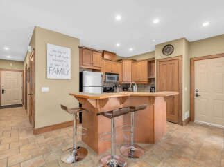 Step into this inviting kitchen, featuring a stylish breakfast bar perfect for casual dining and entertaining.