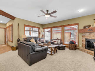 Step into a cozy living space with a rustic charm.