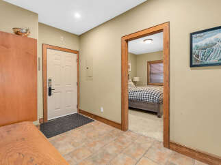 Step into this inviting entryway, showcasing a warm and welcoming atmosphere.