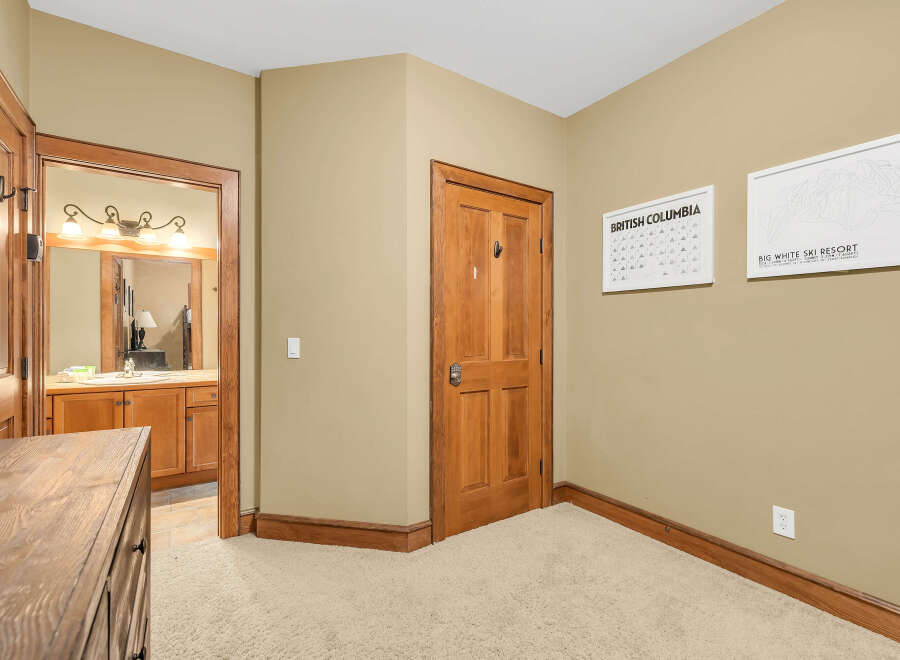Step into this inviting space, featuring a well-lit hallway with a warm, neutral color palette.