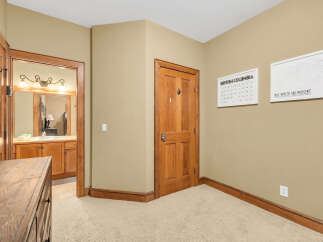 Step into this inviting space, featuring a well-lit hallway with a warm, neutral color palette.
