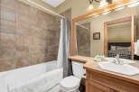 This charming bathroom features a combination of style and functionality.
