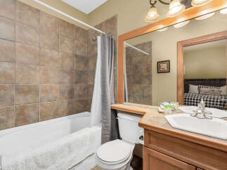 This charming bathroom features a combination of style and functionality.