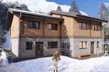 This stunning chalet offers a perfect blend of modern design and alpine charm.