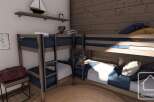 This cozy bedroom features custom-built bunk beds, perfect for a family or group of friends.