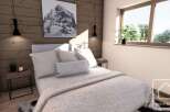 This cozy bedroom features a stunning mountain-themed artwork, adding a touch of nature to the space.