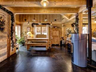 Step into rustic elegance with this stunning property, featuring warm wooden interiors and a cozy ambiance.