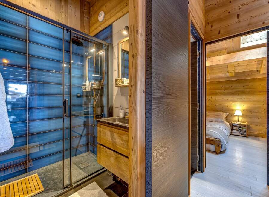 Step into luxury with this stunning property featuring a modern bathroom and a cozy bedroom.