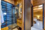 Step into luxury with this stunning property featuring a modern bathroom and a cozy bedroom.