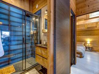 Step into luxury with this stunning property featuring a modern bathroom and a cozy bedroom.