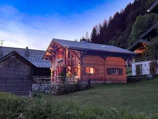Discover the charm of this stunning wooden chalet nestled in a serene mountain setting.