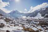 Nestled in a picturesque winter wonderland, this charming property offers stunning views of snow-capped mountains and a quaint village.