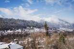 Nestled in a picturesque winter wonderland, this property offers stunning views of snow-capped mountains and a charming village.
