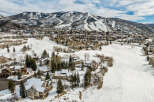 Nestled in a picturesque winter wonderland, this stunning property offers breathtaking views of snow-capped mountains and a pristine, snow-covered landscape.