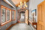 Step into this inviting entryway, showcasing a blend of rustic charm and modern elegance.