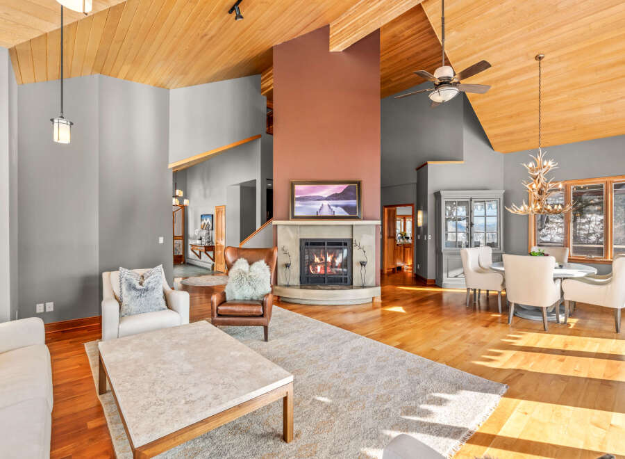 This stunning living room boasts a cozy fireplace, perfect for chilly evenings.