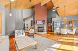 This stunning living room boasts a cozy fireplace, perfect for chilly evenings.