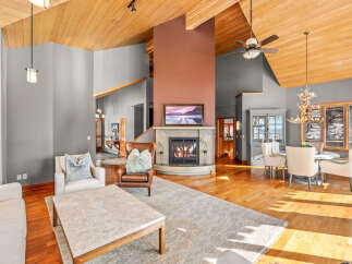 This stunning living room boasts a cozy fireplace, perfect for chilly evenings.
