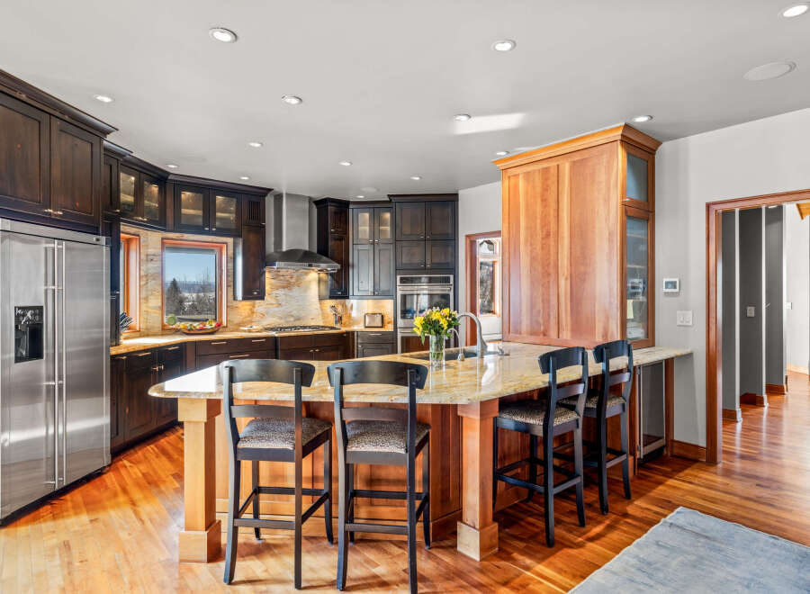 This stunning kitchen boasts a spacious island with seating, perfect for entertaining.