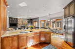 This stunning kitchen boasts a spacious layout with a large island, perfect for entertaining.