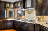 This stunning kitchen boasts dark wood cabinetry, creating a warm and inviting atmosphere.