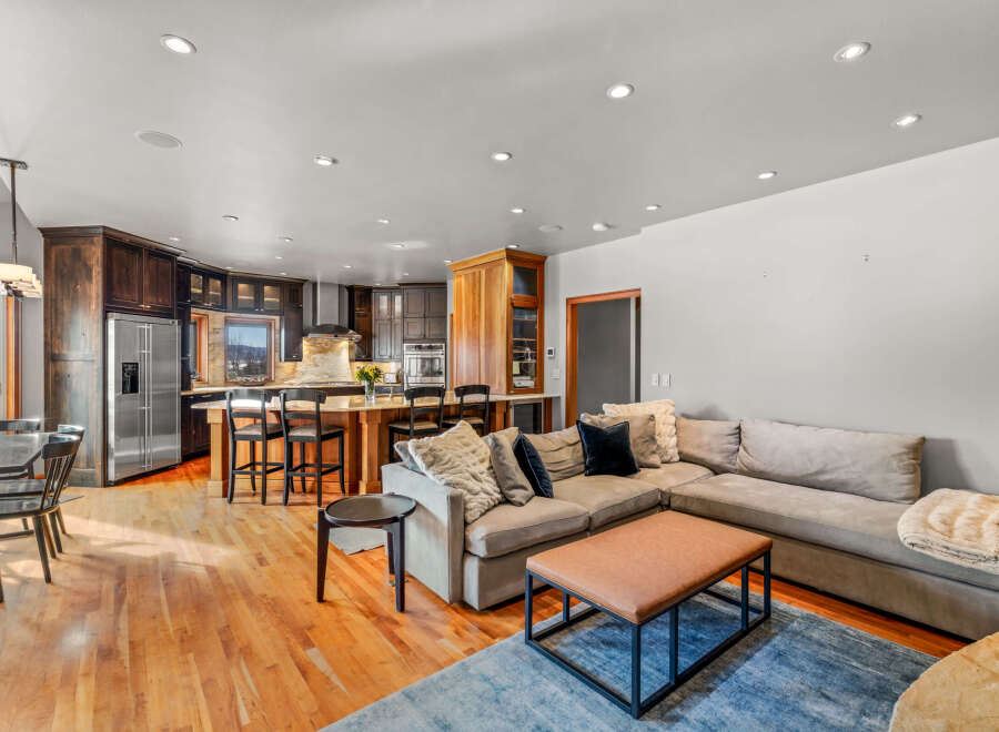 Step into luxury with this stunning open-concept living space! Featuring a gourmet kitchen with stainless steel appliances and a spacious island, perfect for entertaining.